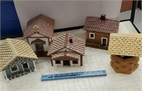 Four wooden houses and wishing well