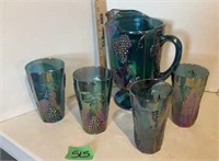 Carnival glass pitcher and glasses