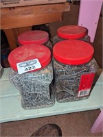 Plastic containers of nails