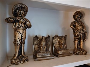 Golden Colored Statues and Bookends