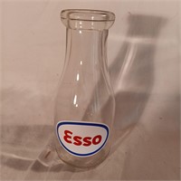 Pint glass milk bottle with Esso sticker on it