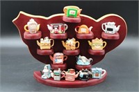 COLLECTION OF RED ROSE AND PORCELAIN MINI TEAPOTS