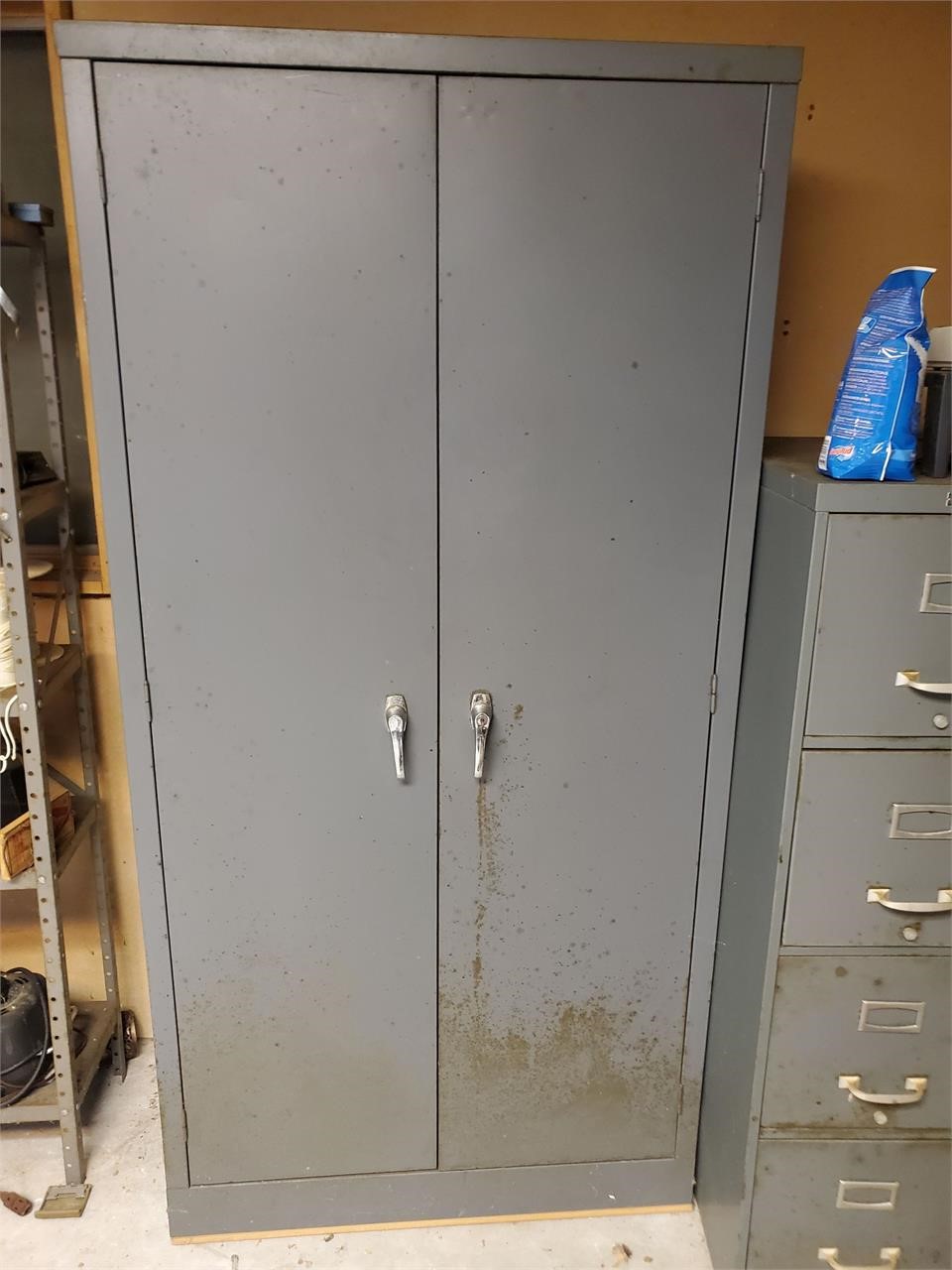 Metal storage cabinet and contents