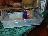 Primitive galvanized caddy full of oil containers