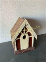Homemade birdhouse with copper roof