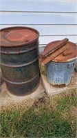 Metal trash barrels,  has rust holes, old