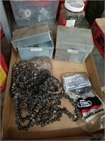 Chain saw chains and 2 storage boxes