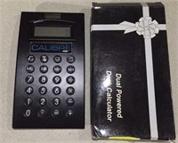 Dual-powered desk calculator, new