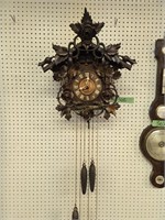 Cuckoo clock with pendulum and weights
