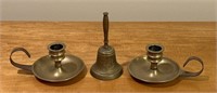 brass bell and candlesticks
