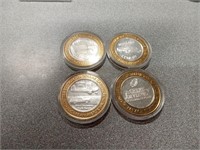 Ten dollar gaming tokens marked 999 silver.