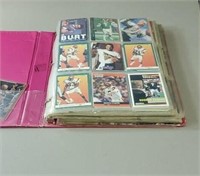 A binder full of football and basketball cards