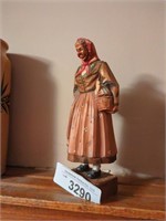 Switzerland hand carved woman with hen in basket