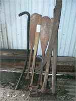 2 paddles, pick, wooden roller, hacksaw