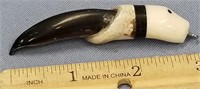 Seal claw with carved ivory head 3"           (f 1