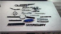 Assorted vehicle brand badging