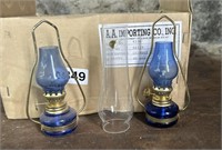 LOT OF SMALL GLASS CHIMNIES AND OIL LAMPS