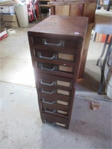 8 Drawer wood cabinet with large collection of