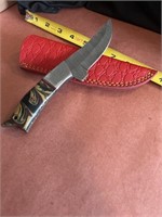8 inch Damascus steel knife with leather case.