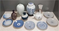 Group of Asian porcelain pieces including tea jar,