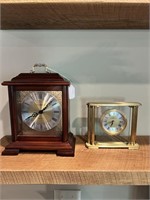 Two Howard Miller Battery Operated Clocks.