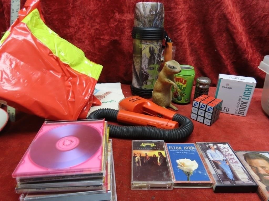 Thermos, gopher bank, flashlight, music CD's