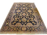 9’ 5” by 11’ Floral wool rug in black and