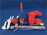 Assorted kitchen items including measuring cups,