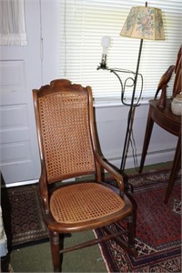 Rocking chair with cane seat and back and a