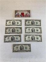 7 $2.00 Bills and Santa Dollar