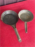 Two vintage aluminum camping skillets