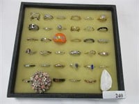 36 costume jewelry rings, case not included