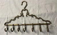 Brass decorative hanger w/hooks. 16” L