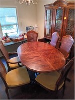 Dining room table with six wicker back chairs,