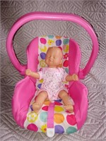 C9) baby doll and car seat. Missing the shoulder