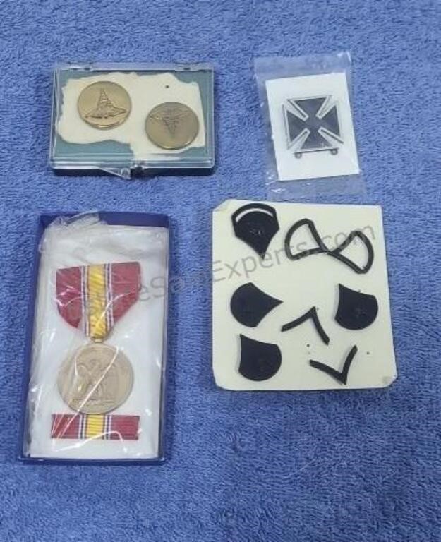 Military pins and medal.