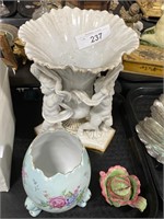Porcelain cherub vase, egg vase, pottery.