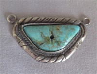 Stamped handmade sterling pedant with turquoise.