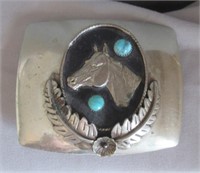 Southwest style belt buckle with turquoise.