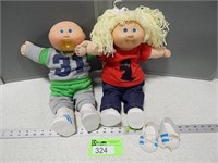 2 Cabbage Patch dolls and an extra pair of shoes