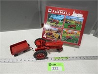 Farmall replica tractor, small wagon and a puzzle
