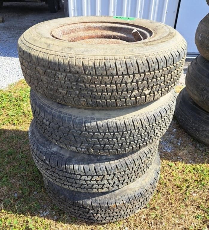 Four P205/75r14 tires on rims