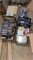 Several CDs, DVDs, VCR, tapes and cassette tapes.