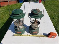 Two Coleman lanterns one is damaged