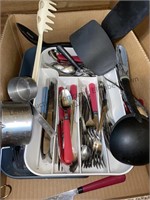 Assortment of kitchen cutlery, spatulas,
