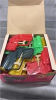 Box of vintage toy BB Guns