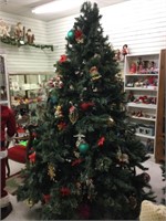7ft tall Decorated large faux holiday tree. With
