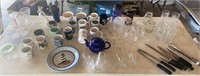 Blue tub of misc coffee mugs, clear glassware,