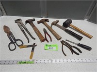 Crimper; tin snips; hammers; rubber mallet; side c