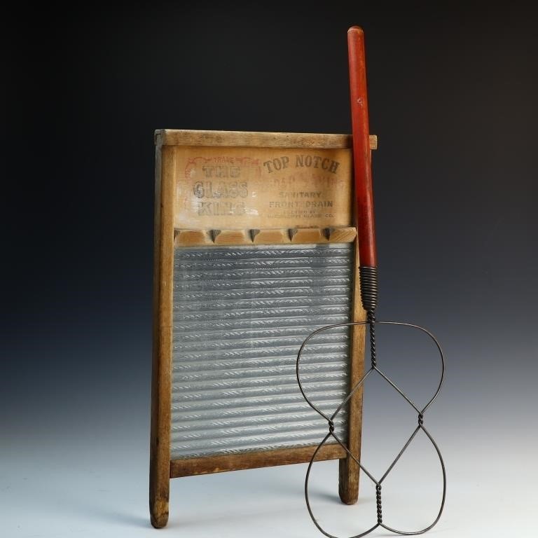 Antique rug beater and a glass washboard